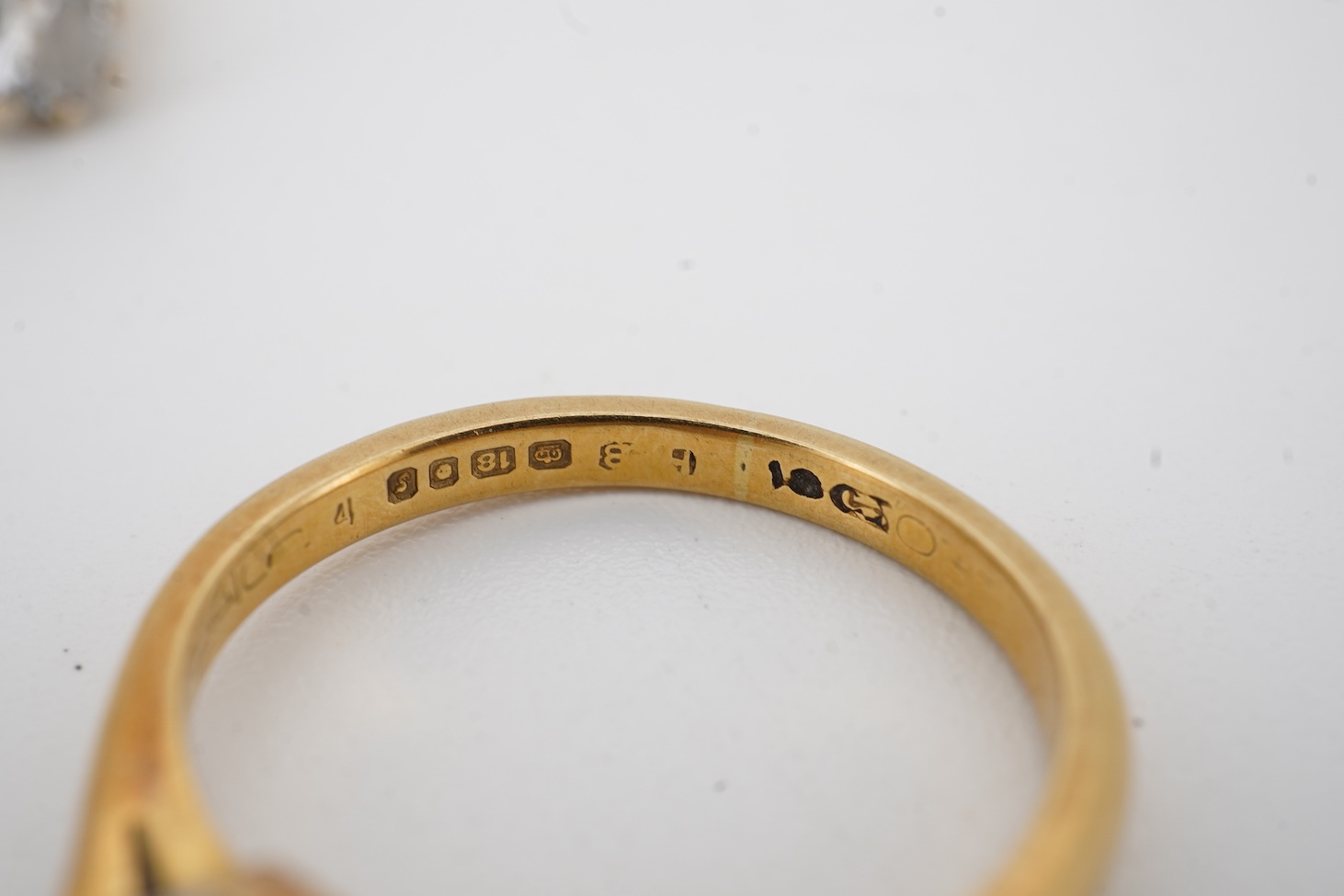 An early 1970's 18ct gold and claw set solitaire diamond ring, size K/L, the stone weighing approx. 0.33ct, together with a yellow metal and solitaire diamond ring, the stone weighing approx. 0.50ct, size P/Q, gross weig